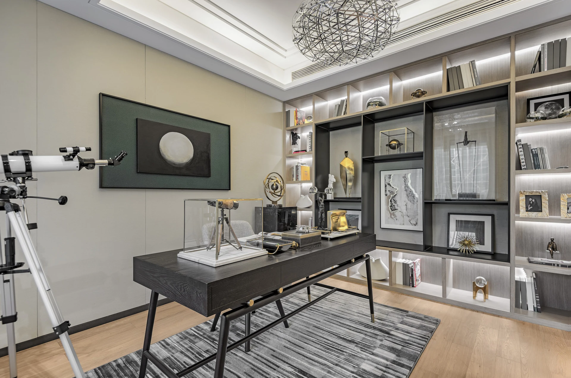 Home office with built-in desk and display shelving wall by Vamaylo