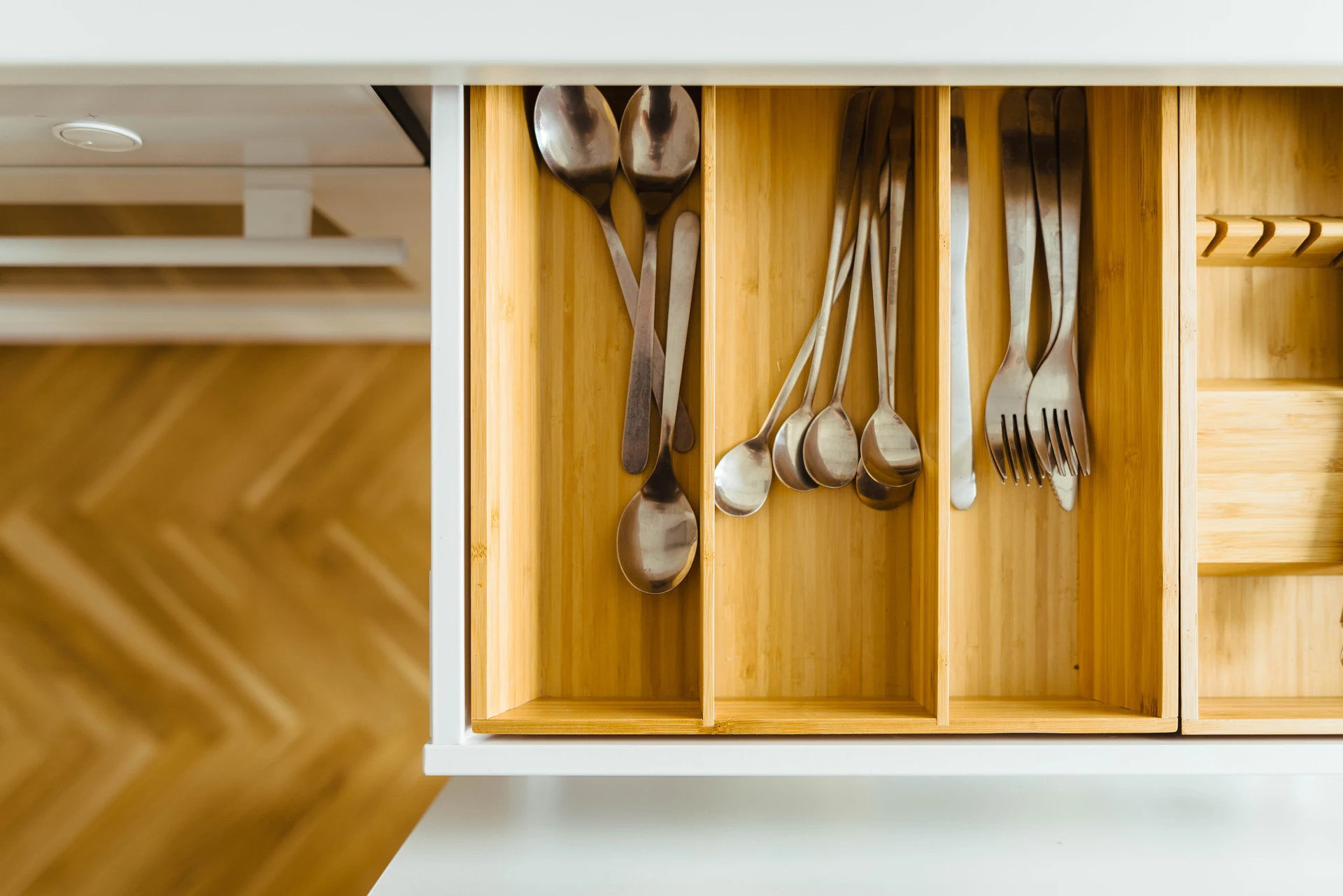 Custom drawer organizer with cutlery dividers in a Vamaylo kitchen